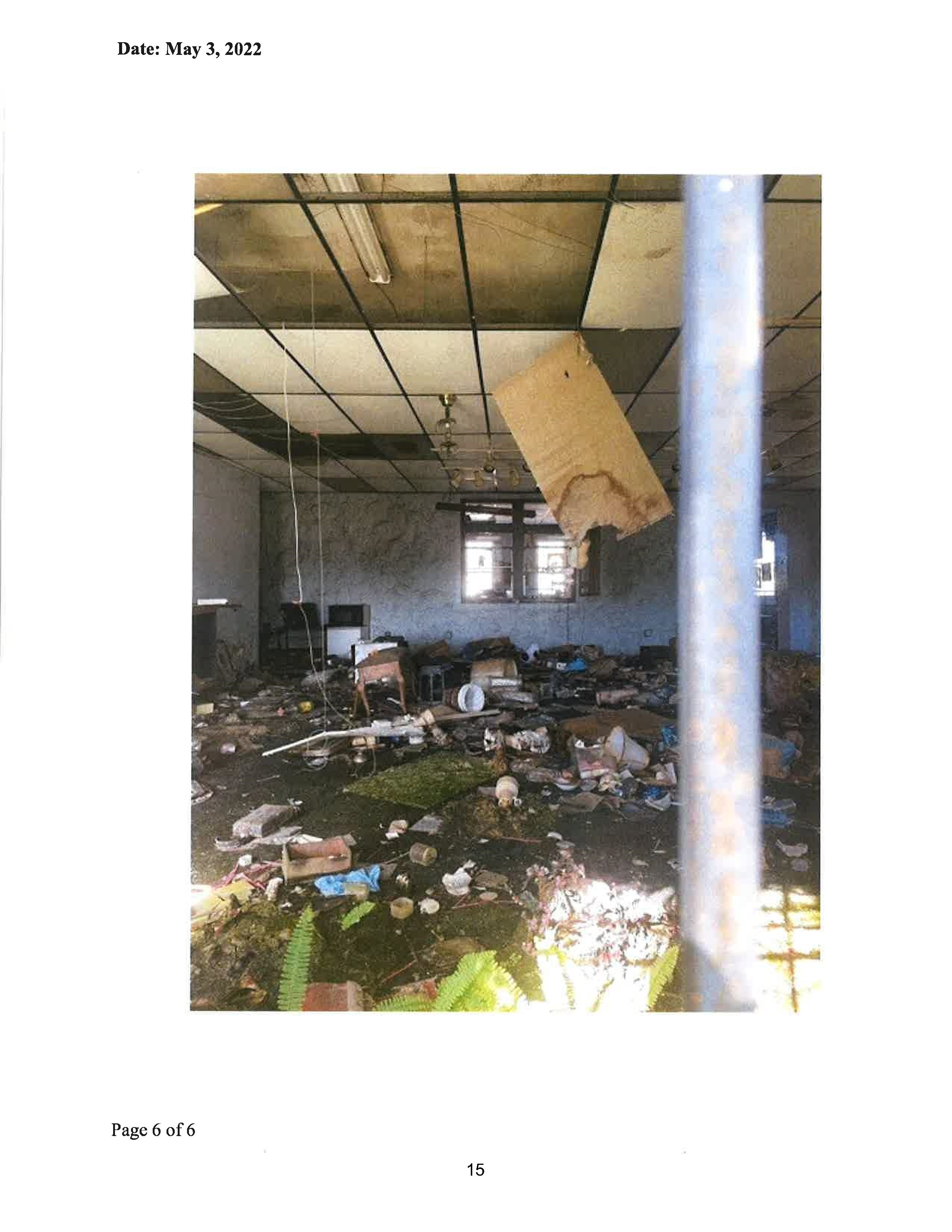 Photo from City of Williston Agenda Packet: It appears this room is full of leftovers from the store. Note the missing ceiling tiles.