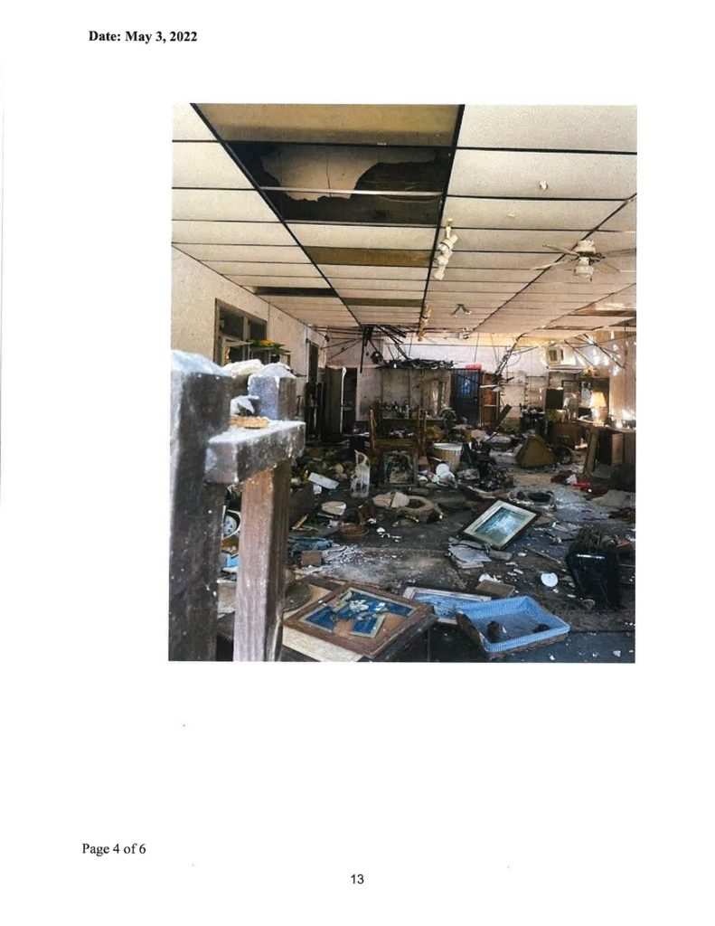 Photo from City of Williston Agenda Packet: This portion of one of the rooms in the former Pesso's Pawn Shop shows materials strewn about including old picture frames.