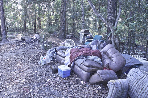 This is what the lot behind the Post Office looked like before property owner Jackie Mitchem cleaned it up a few weeks ago.