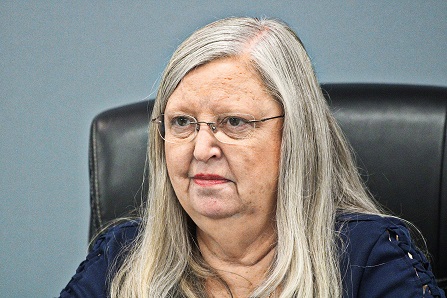 Council President Debra Jones listens as Mayor Charles Goodman makes a statement.