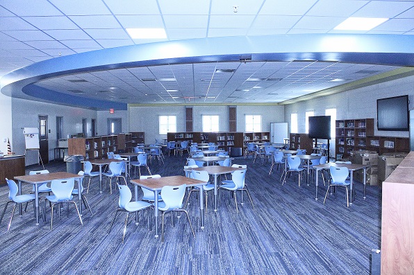 The media center is spacious. It doesn't have banks of computers because all students are equipped with Chromebook laptops. They carry their word processors and internet with them.