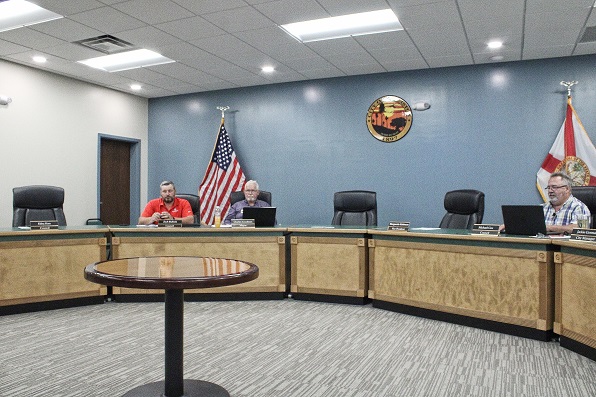 This is what the council looked like during the meeting. Councilman Zach Bullock in red shirt is seated next to Mayor Charles Goodman. Councilman Michael Cox is on the far right. Council President Debra Jones is seated out of view in a room behind the door on the left. Was there a quorum of three voting council members? Goodman says no, Jones yes.