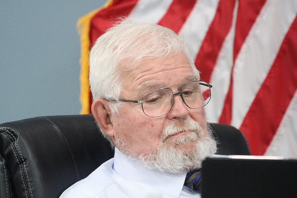 Mayor Charles Goodman appears relaxed as he listens to City Manager Jackie Gorman's rant.