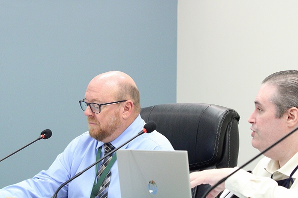 Interim City Manager Terry Bovaird on the left listens as City Finance Director Steven Bloom outlines important aspects of the new budget.