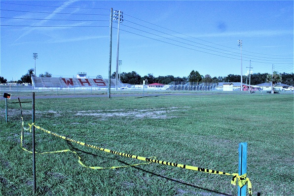 This vacant field directly opposite the Williston High School stadium has been purchased by the Levy County School Board and will remain a public parking area.