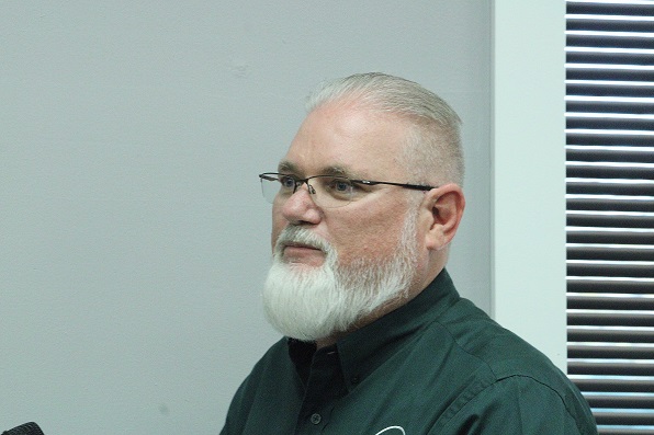 Tim Alexander, deputy executive director of the Suwannee River Water Management District, listens to questions from Chiefland City Commissioners.