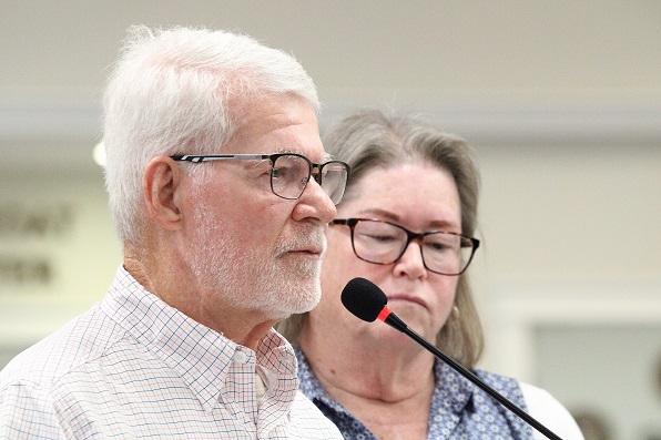 Jay Ronald Beasley speaks to city council members about the sidewalk for Stadium View Acres as his wife Jane listens.