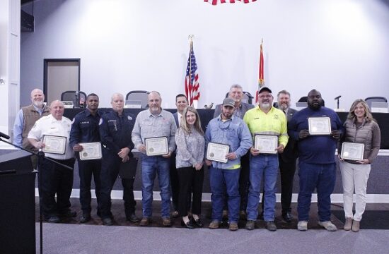 Employees of the Levy County Commission who have serve county government for many years are recognized by the board. Shown from the left are Commissioner Rock Meeks, Jason Hughes with 5 years Department of Public Safety, Shenard Blake 5 years with Department of Public Safety, Harry Sparks 10 years with Department of Public Safety, Chuck Cook 35 years with Construction and Maintenance, Commission Chairman Matt Brooks, Commissioner Desiree Mills, Chance Cummings 5 years with Road Department, Commissioner Tim Hodge, Robert Jordan 25 years with Road Department, Commissioner John Meeks, Jose Thomas 25 years with Road Department, Catrina Sistrunk 5 years with Tourist Development.