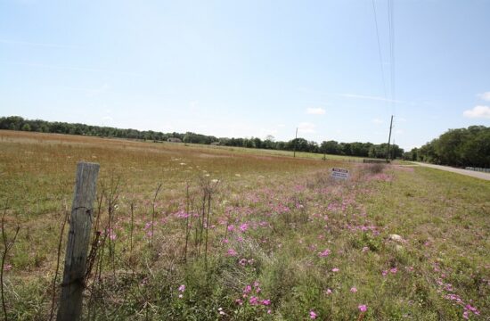 It's an ordinary looking field at the corner of County Road 316 and U.S. 27 a couple of miles outside Williston. County Road 316 can be seen on the right. The field was purchased by Nature Coast Soils LLC for $1.6 million. Billionaire Reid Nagle is the owner. Nature Coast Soils LLC shares an address in Ocala with All-in Removal. Photo by Linda Cooper