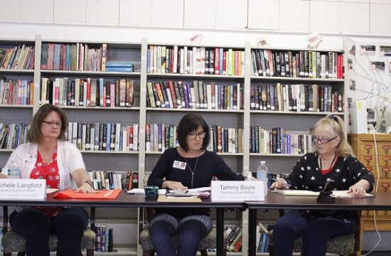 Otter Creek Canvassing Board members Michele Langford, Levy County Tax Collector, Chairwoman Tammy Boyle, Levy County School Board member, and Mary DeGroot, Otter Creek town clerk, discuss provisional ballots.