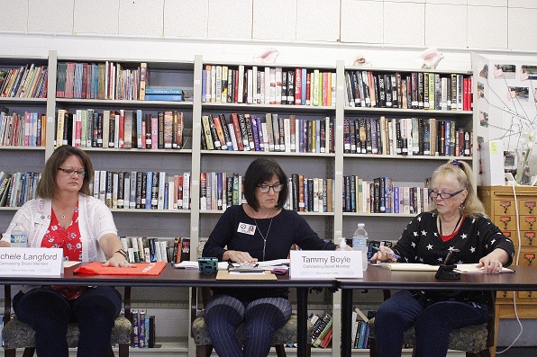 Otter Creek Canvassing Board members Michele Langford, Levy County Tax Collector, Chairwoman Tammy Boyle, Levy County School Board member, and Mary DeGroot, Otter Creek town clerk, discuss provisional ballots.