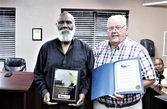 Councilman Aaron Edmondson is honored for his service with a proclamation from Mayor Robert Partin.