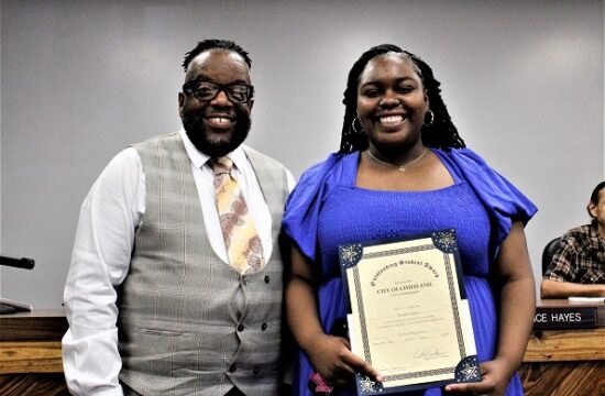 Chiefland City Commissioner Lance Hayes presents Kayjah Graham with her Student of the Month Award.
