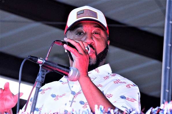 Singer Reggie Stacy of Bronson performs at Horseman's Park.