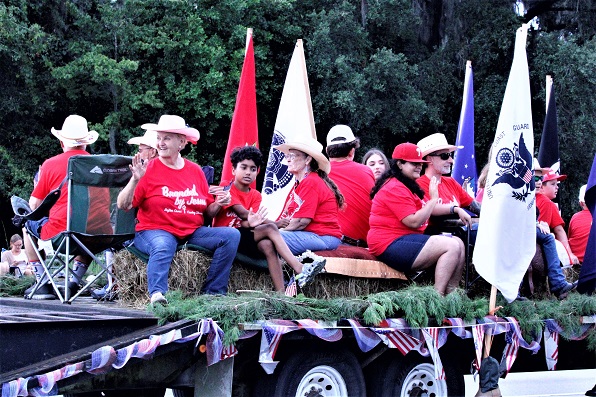 Rafter Cross Cowboy Church won first place in floats. Church members wore Branded by Jesus shirts.