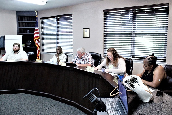 Bronson Town Council members attend to business at Monday's meeting. From the left are council members Tyler Voorhees, Franklin Schuler, Mayor Robert Partin, Virginia Phillips and Sherrie Schuler. Partin briefed board members on the Waccasassa Water and Wastewater Cooperative.