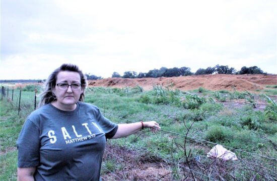 Rose Fant stands on farmland she and her husband Ben own adjoining a horse stall waste dump. She is strongly opposed to manure composting sites having lived next to one for a dozen years. file photo