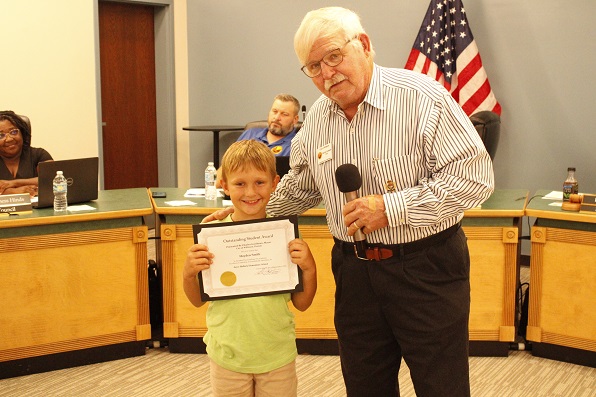 Student of the Month Hayden Smith received his certificate from Williston Mayor Charles Goodman.